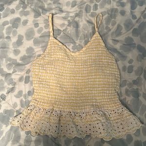 white and yellow striped shirt with flower ruffle at the bottom